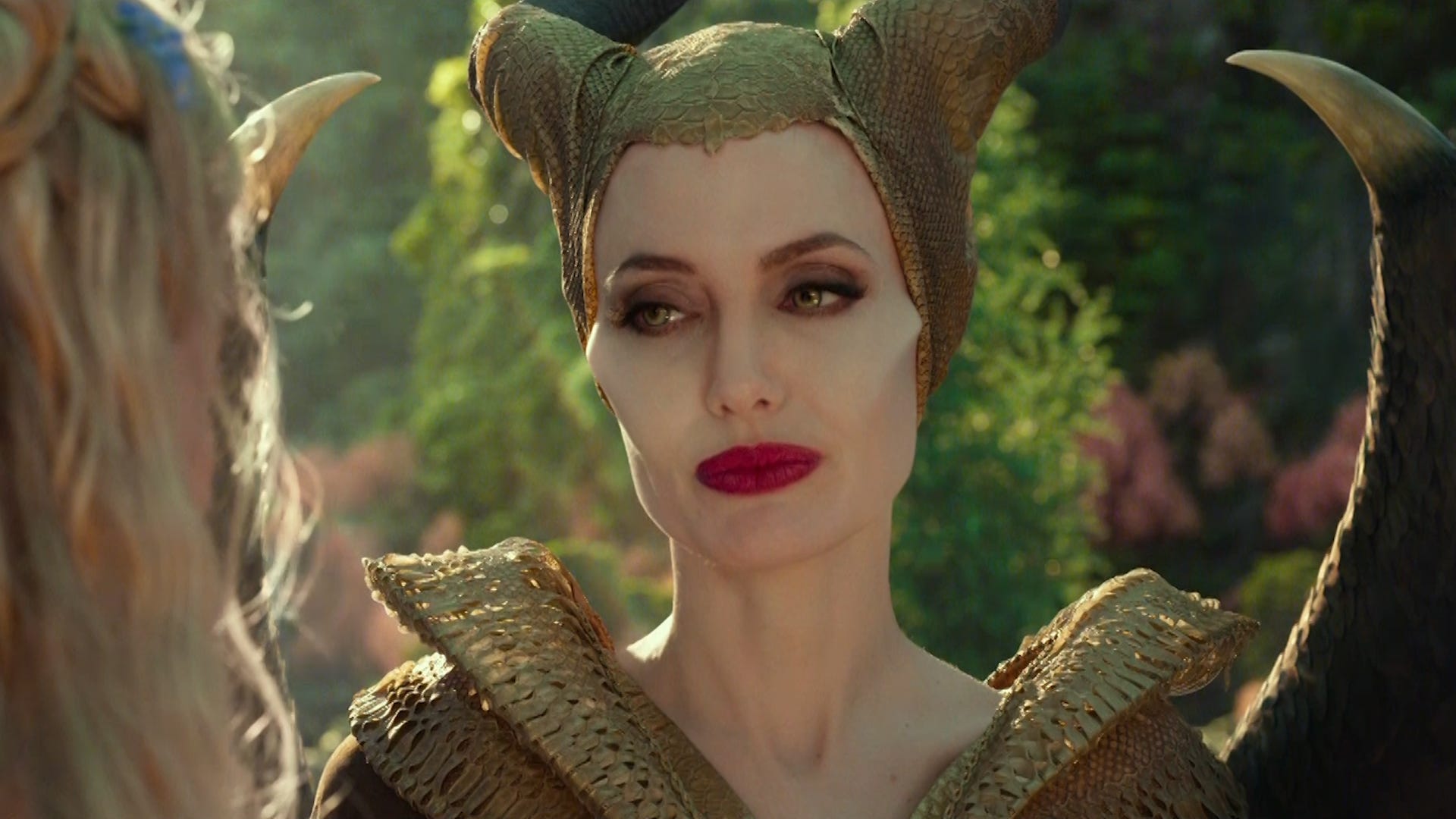 Maleficent (Jolie) looks fondly at Aurora (Elle Fanning in Maleficent: Mistress of Evil