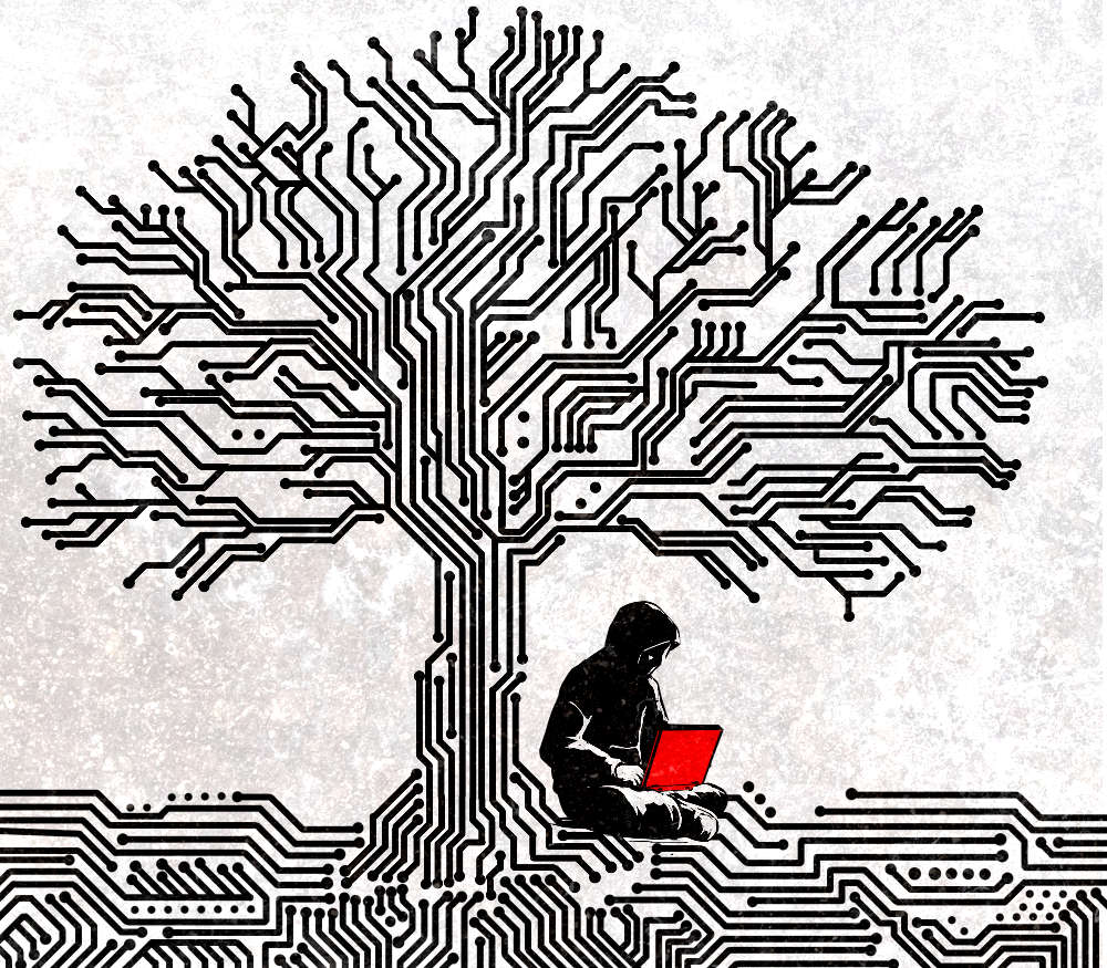 A tree made of circuits. Person sitting at base with laptop.